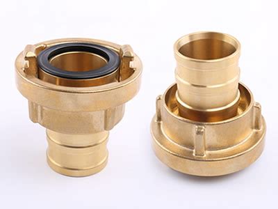 Photo showing various Storz coupling components made of aluminum and brass.