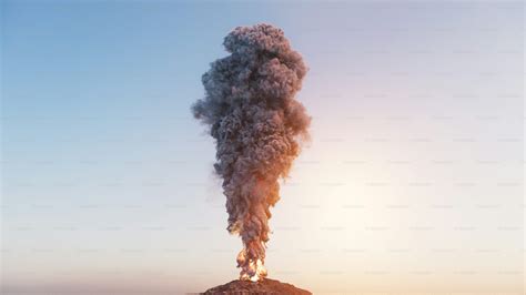 Aerial photo of dense smoke plume rising from an industrial area, visible from a distance