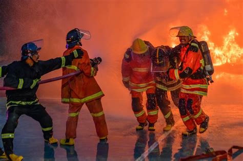 Thematic photo of a firefighter in action, helping people or extinguishing a fire
