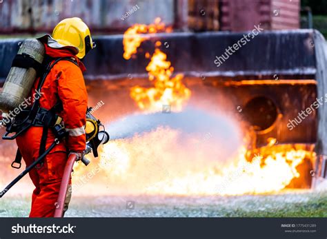 Thematic photo of firefighters in action, extinguishing a fire or during rescue operations