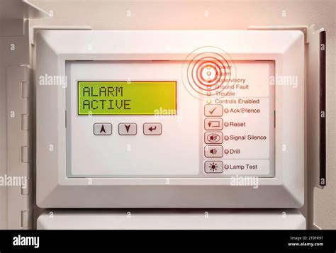 Photo of a fire alarm control panel with a display and buttons