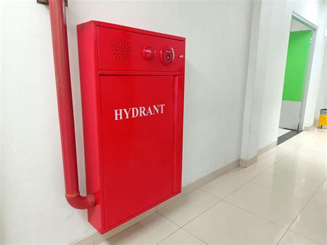 Thematic photo of a fire hydrant in a school corridor