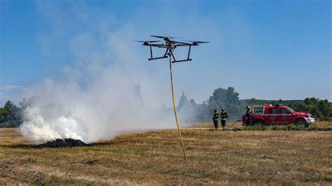 Drone shot of a forest fire with firefighters in action