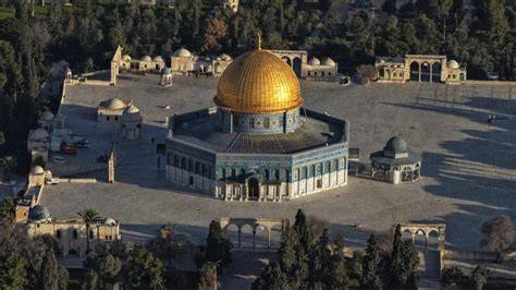 The Al-Aqsa Mosque complex with smoke visible from one of its buildings