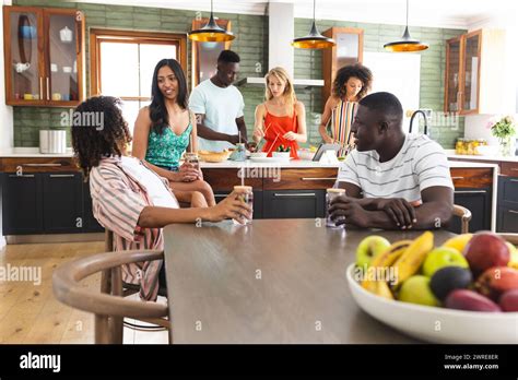 Thematic photo of a modern OSP kitchen with people socializing