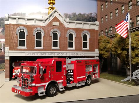 Thematic photo of a 1:87 scale fire truck model on a display stand