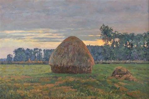 Płonący stóg siana w otoczeniu krajobrazu wiejskiego