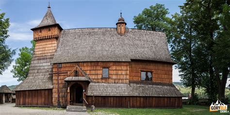 Zdjęcie historycznego, drewnianego kościoła w Mileszkach przed pożarem