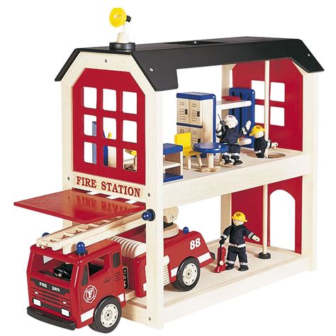Thematic photo of a wooden BigJigs fire station toy with firefighters