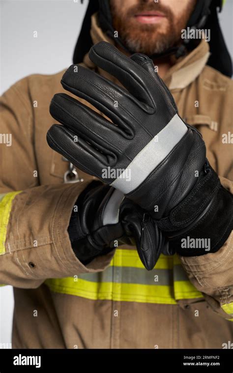 Thematic photo of firefighter wearing protective gloves