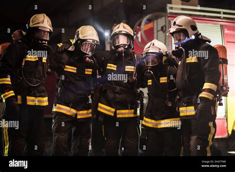 Thematic photo of firefighters in uniforms with visible patches