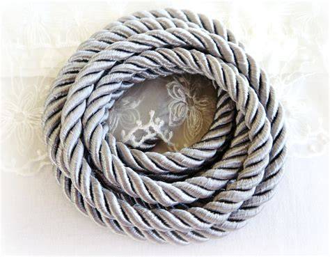 Photo of a silver gala cord with a blue thread