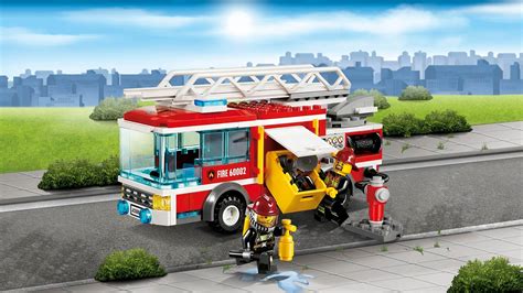 Close-up photo of LEGO City Fire Truck 60002 accessories including axe, extinguisher, and hose