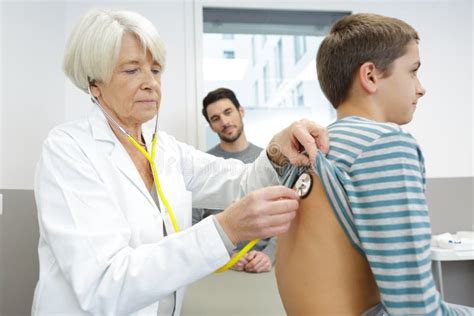 Thematic photo of a doctor examining a child with a rash.