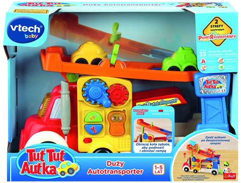 The VTech 60813 Tut Tut Autka Fire Station playset, showing various interactive elements and a red fire truck.