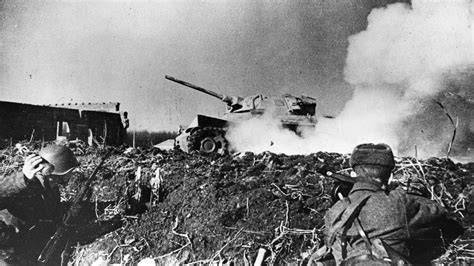 Photo of an insurgent attacking a German tank with a Molotov cocktail