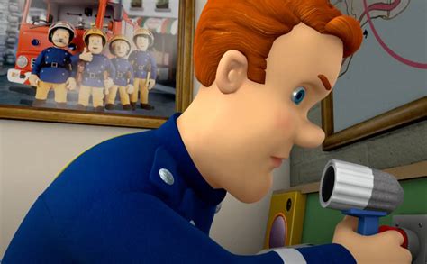 Thematic photo of Fireman Sam and his friends standing by the fire station