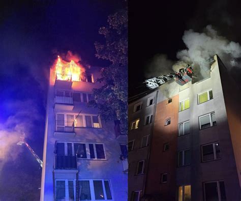 zdjęcie dymu wydobywającego się z okna mieszkania na piątym piętrze bloku