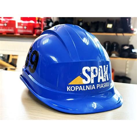 Logo firmy KASK z hasłem o bezpieczeństwie