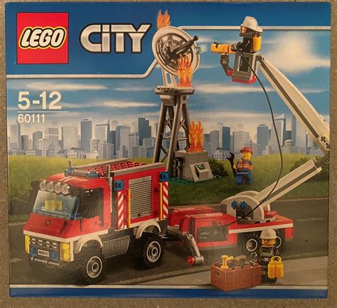 Three minifigures from LEGO City 60111: a technician and two firefighters
