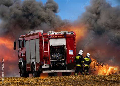 Thematic photo of OSP firefighters in action with a fire truck