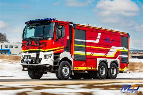 The Renault K 440 6x6 fire truck with Moto-Truck body in action, showing water cannon and extended light mast