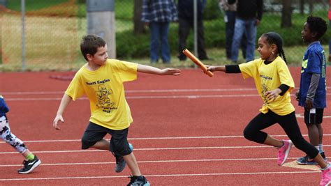 Photo of firefighters competing in a sports and fire competition (relay race or combat exercise)