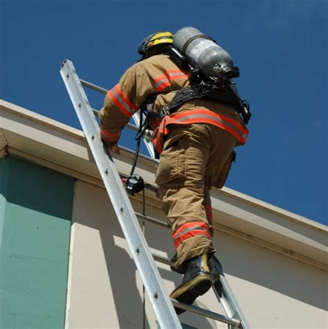 Thematic photo of firefighters on a ladder during training