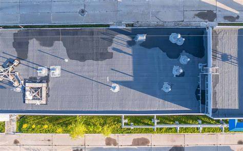 Drone shot of a burned-out building roof in a small town