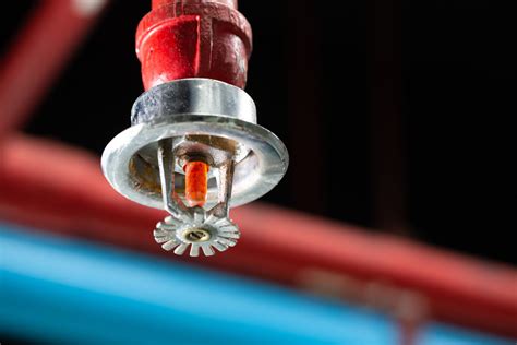 Graphic illustration of fire protection systems (sprinklers, alarms).