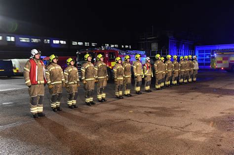 Thematic photo of OSP firefighters participating in a community event or parade with their fire trucks