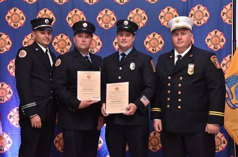 Photo of the award ceremony with firefighters receiving trophies