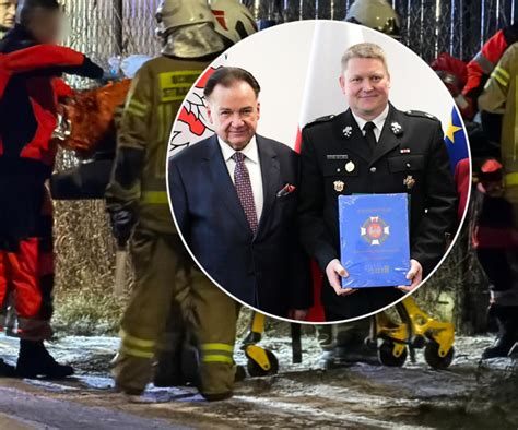 Strażak ratujący matkę z dzieckiem z płonącego budynku za pomocą drabiny przystawnej