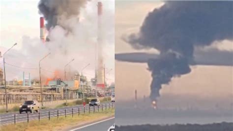 Słup czarnego dymu unoszący się nad rafinerią i płonącymi zbiornikami ropy w aglomeracji Teheranu