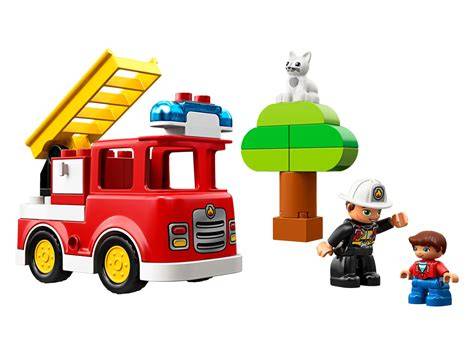 The LEGO DUPLO Fire Truck 10901 with a firefighter figure and a cat in a tree