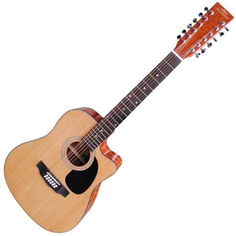 Gitara akustyczna leżąca na nutach, obok leży kapodaster