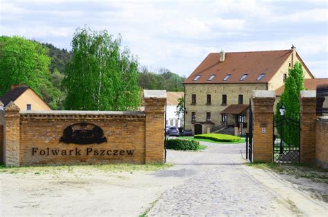 Thematic photo of Folwark Pszczew from drone, showcasing its renovated buildings and surrounding landscape