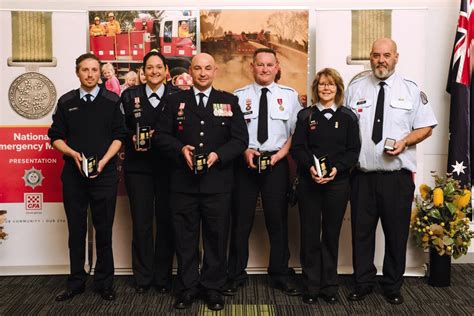 Group photo of awarded firefighters with local authorities