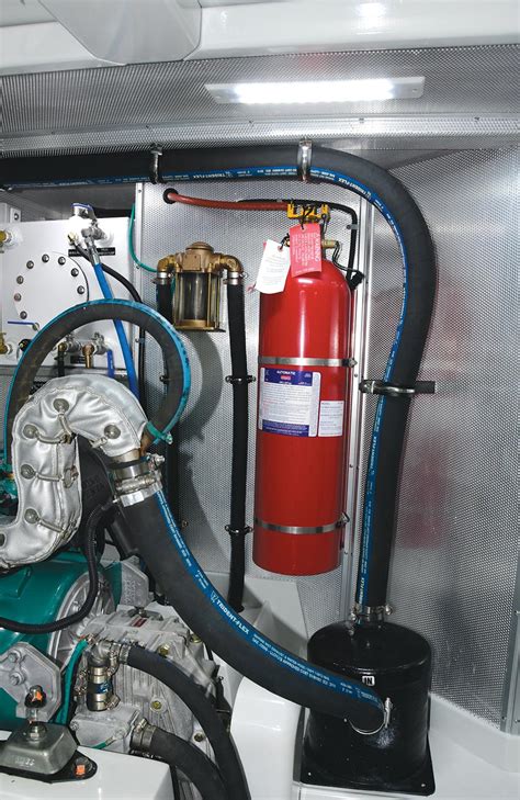 Thematic photo of a yacht engine compartment with a fire extinguisher nearby