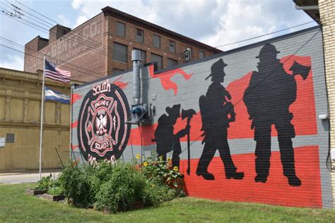 Photo: mural on a fire station building, educational hall with graphic elements