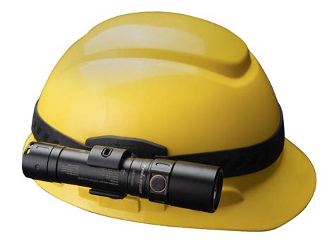 Technical drawing or close-up photo illustrating the improvised screw mounting of a flashlight holder on a Dragom HT helmet
