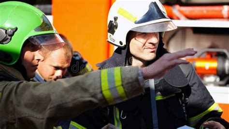 Thematic photo of firefighters in action, commander giving instructions