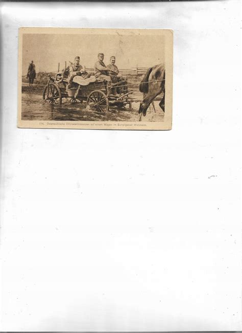 Historyczna fotografia strażaków z Dąbrowicy przy pierwszej motopompie i wozie konnym