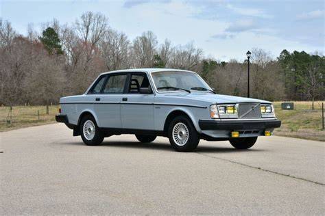 The iconic Volvo 240 sedan and wagon side-by-side, showcasing their classic design