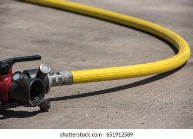Thematic photo of a flat hose being unrolled or connected to a pump