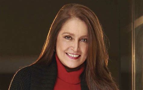 Zdjęcie przedstawiające Daniela Romo i Krzyśka Kłowatego na tle motocykli