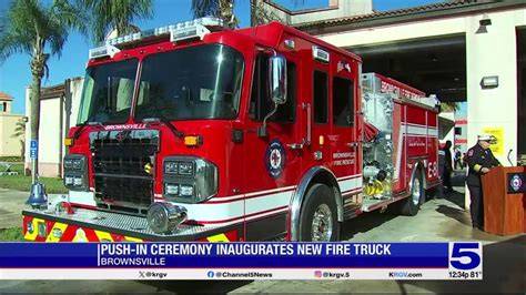 Photo of an OSP ceremony with a new fire truck and local community