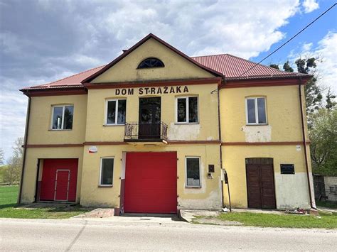 Thematic photo of a modern fire station or Dom Strażaka in a rural Polish setting