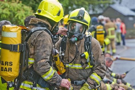 Infographic illustrating the various tasks of a volunteer fire brigade (firefighting, rescue, technical assistance, environmental protection, education)