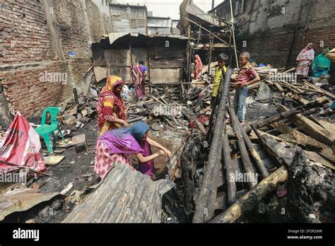 Photo of the aftermath of a slum fire in Dhaka, showing destroyed shanties